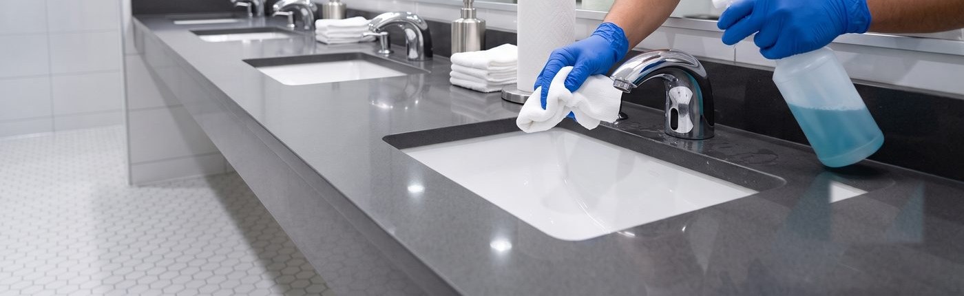KO Commercial Cleaning sanitizing a commercial restroom